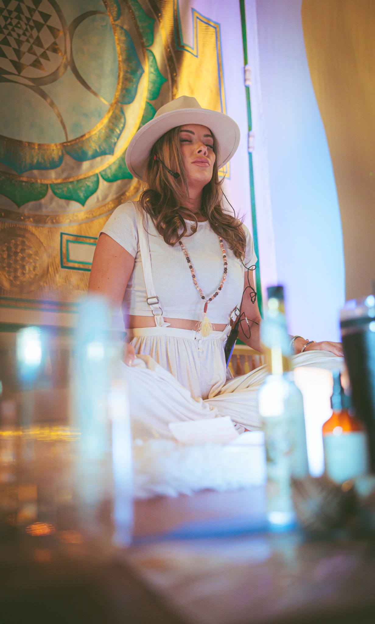 Tori facilitating ceremony in white