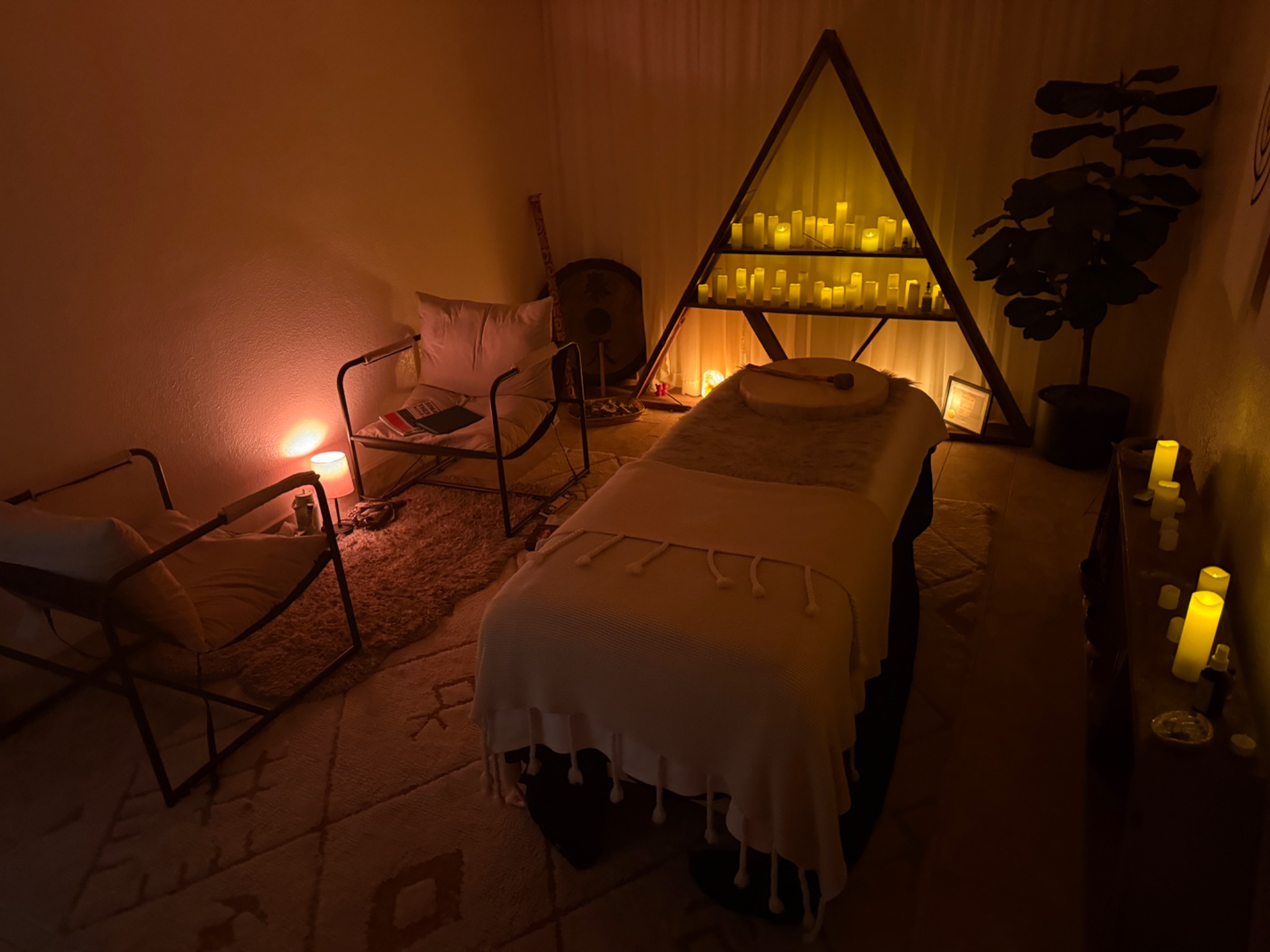Candlelit sacred treatment room
